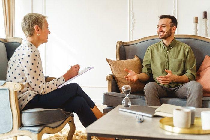 Therapist taking notes during session