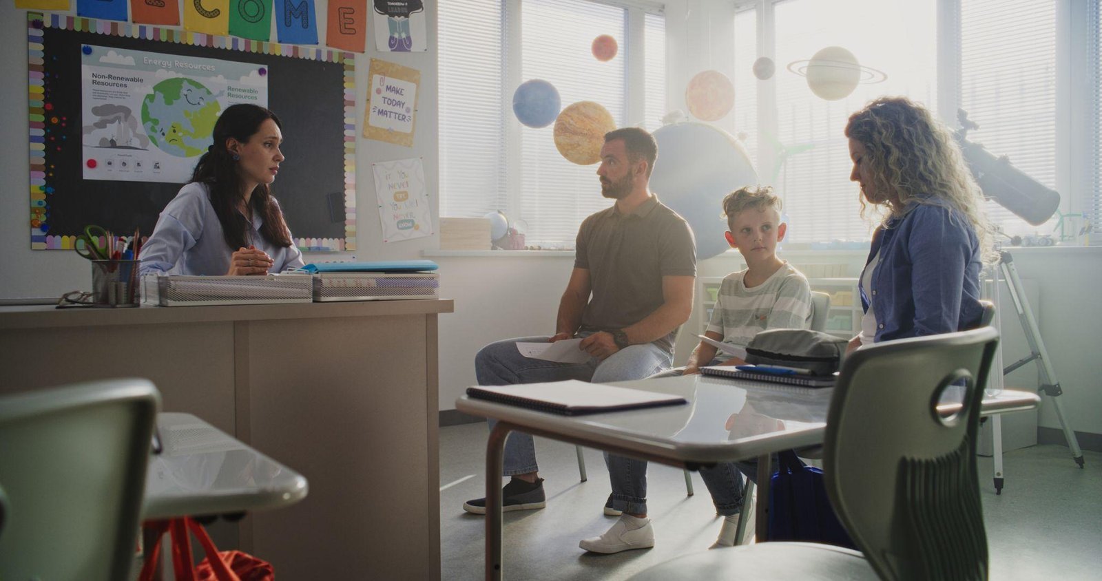 Teacher helping student with school work