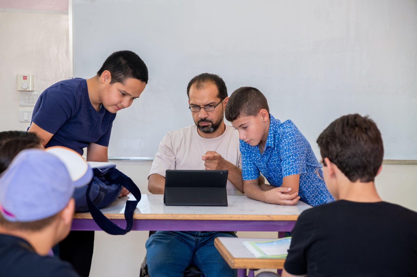 Educational professional helping a student translate assessment results into practical learning strategies and goals.